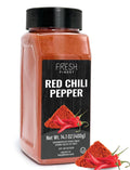 Red chili pepper seasoning jar with black cap and orange-red powder