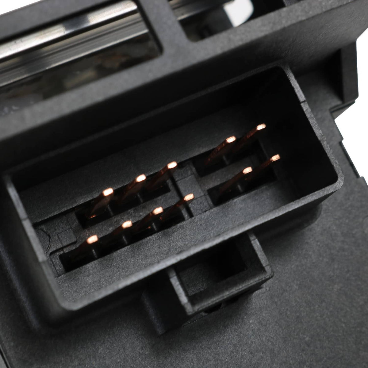 Black electrical connector section of the dash headlight switch with multiple terminals