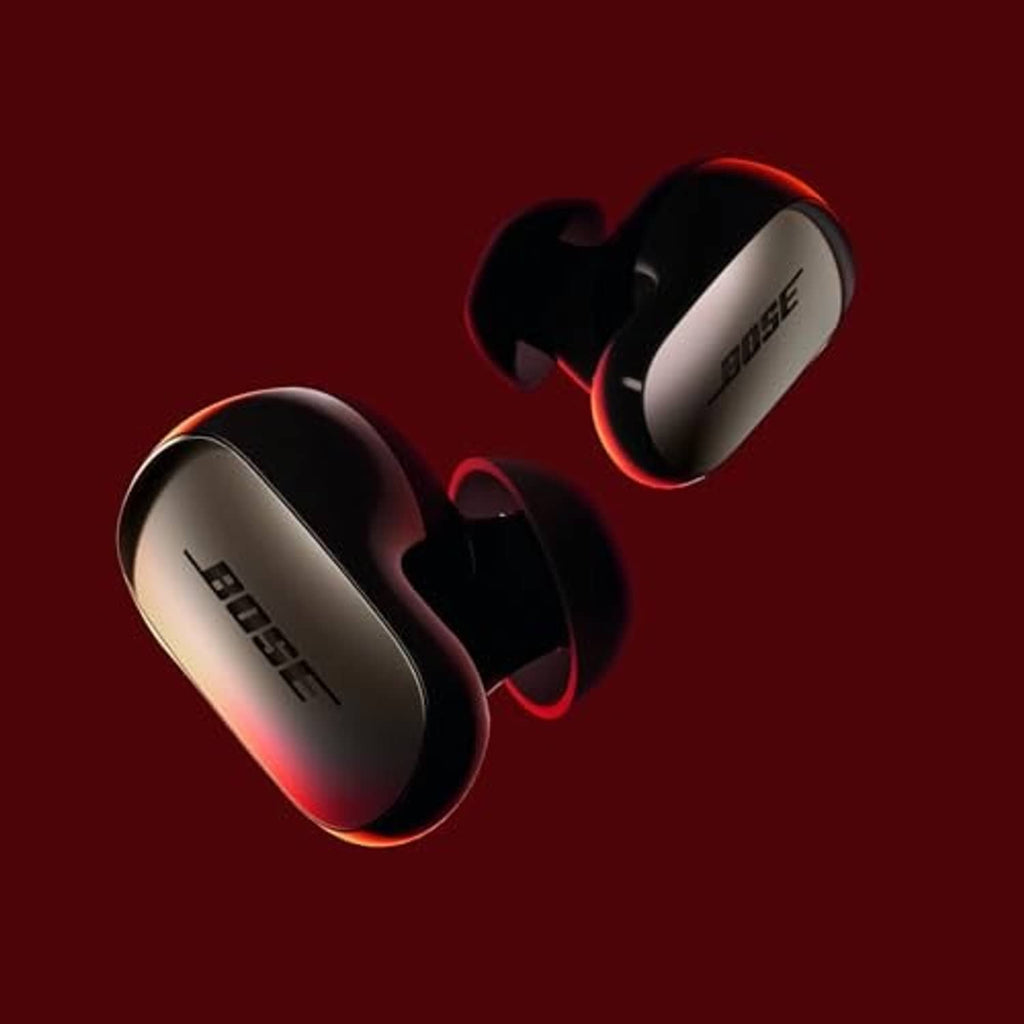 Black wireless earbuds with ear fins, glossy finish and smooth oval ear pieces