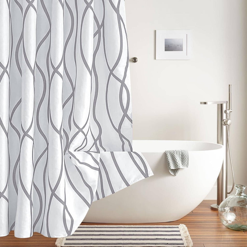 Silver gray shower curtain with repeating wavy line pattern and pleated fold at bottom