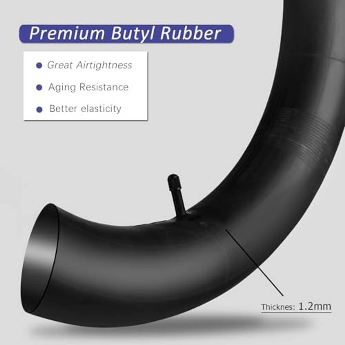 Curved view of black butyl rubber bike inner tube, Schrader valve on tube