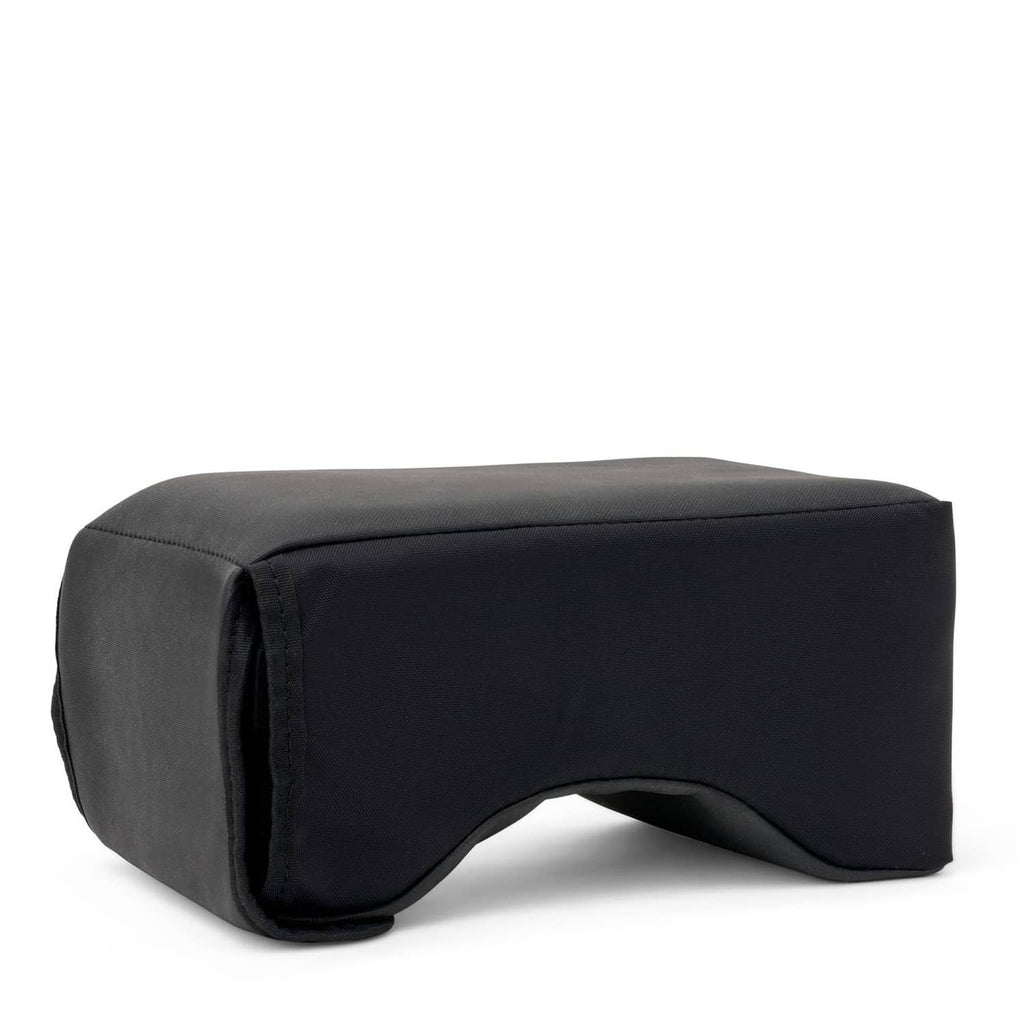 Black padded lap rest with raised side bolster and curved inner support