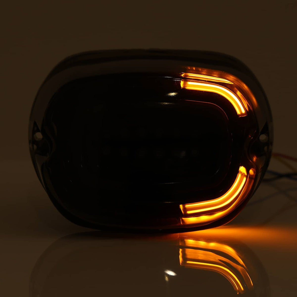 Smoked LED rear tail light with amber turn signal bars, side and angled view