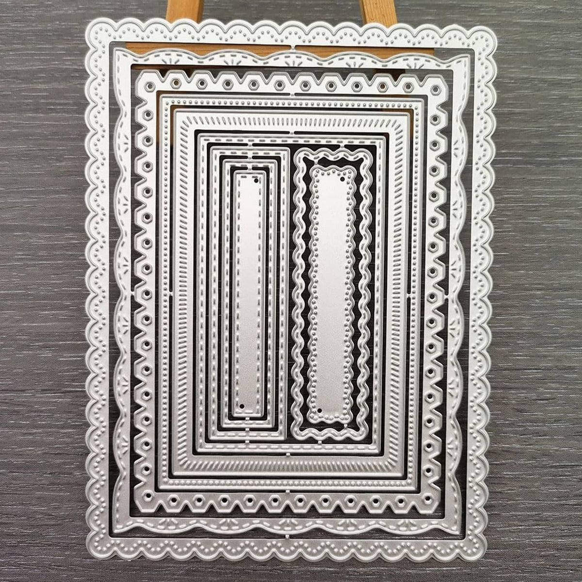 Nested rectangle frame cutting dies with layered square frames and decorative scalloped border