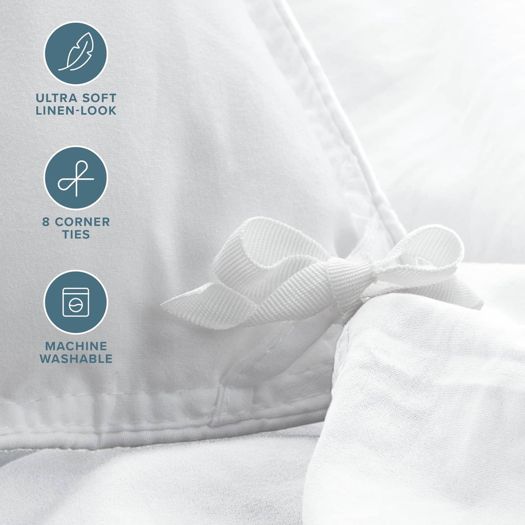 White duvet cover fabric close-up with corner ties and bow