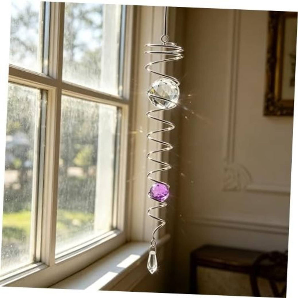 Silver spiral gazing ball wind spinner with clear crystal orb, purple bead, and teardrop charm