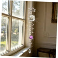 Silver spiral gazing ball wind spinner with clear crystal orb, purple bead, and teardrop charm