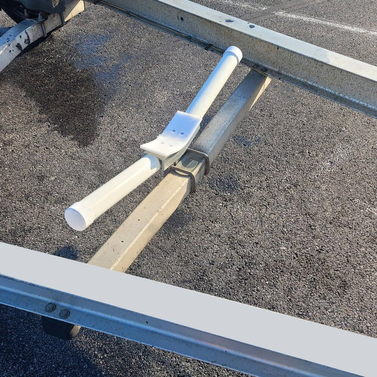 Installed bow rest centering guide on trailer frame with white PVC guide post