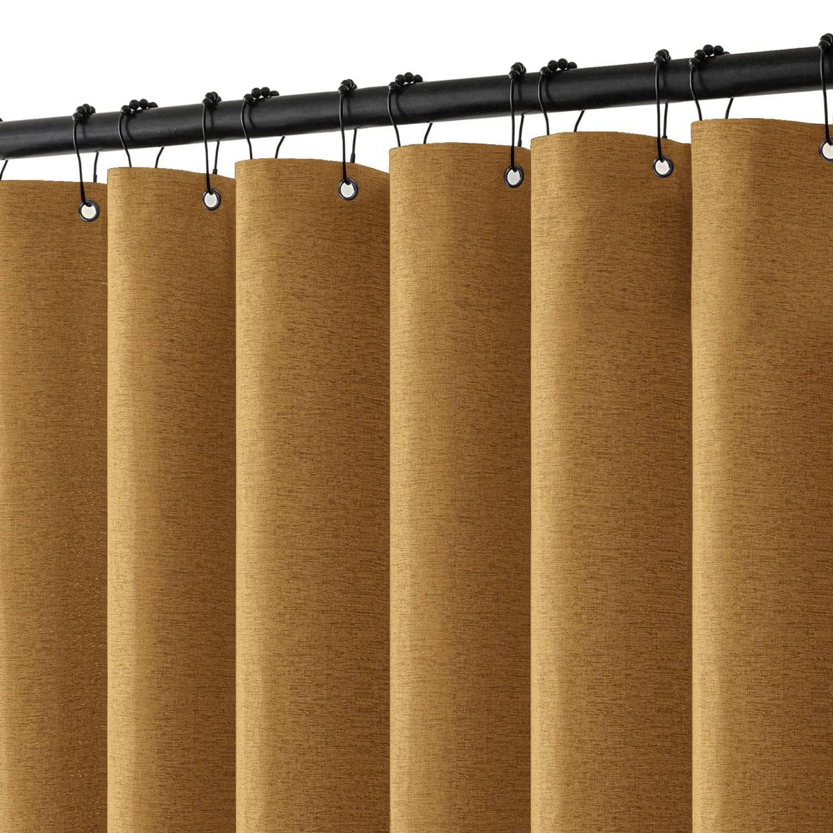 Gold linen-look shower curtain with black hanging hooks on top rod header