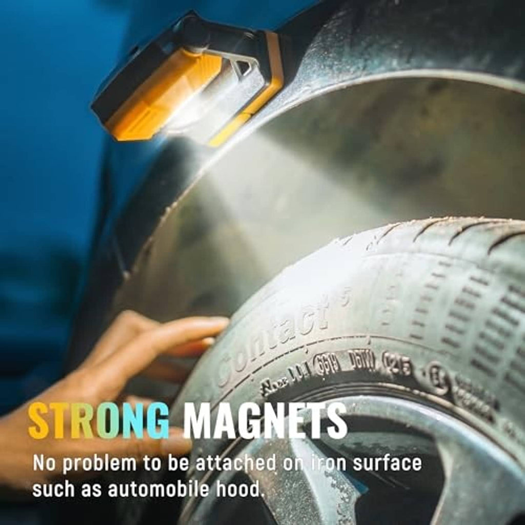 Orange rechargeable work light magnet-mounted on a metal surface near water splashes
