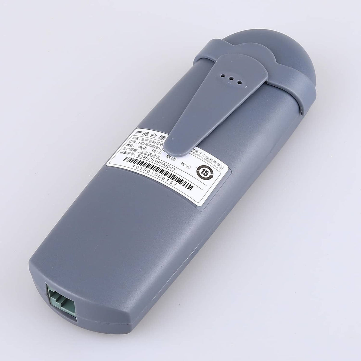 Phone line tester bottom view with label and modular connector port