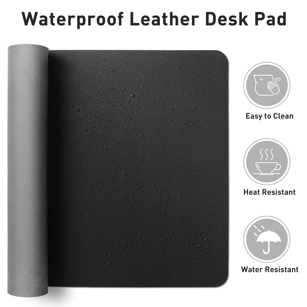 Rolled black water-resistant PU leather desk pad with visible water droplets