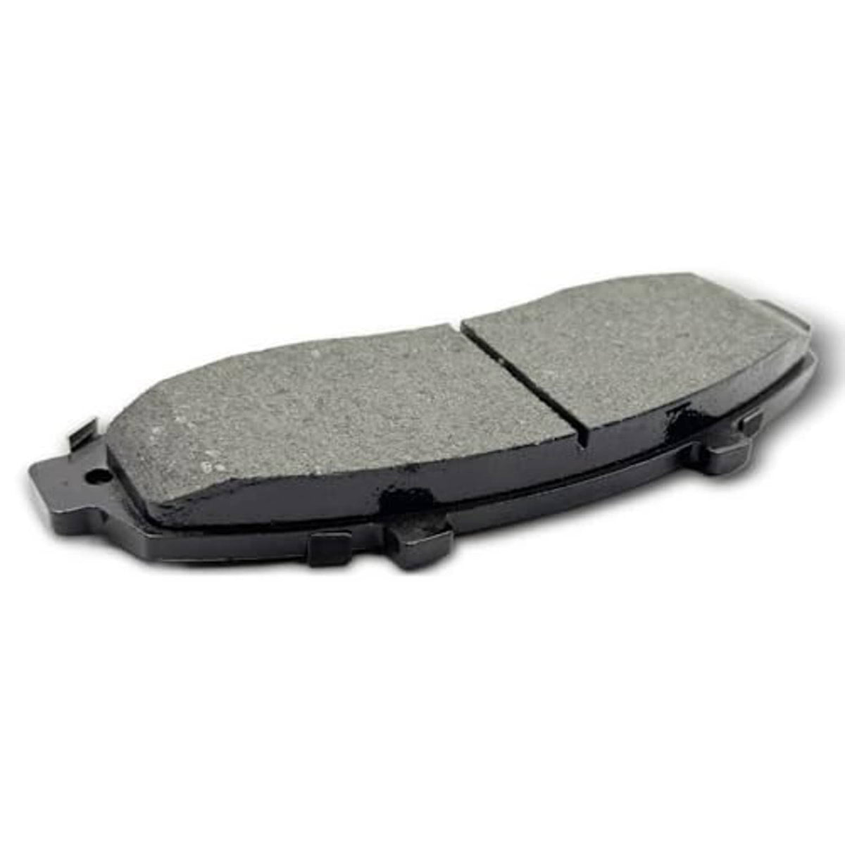 Ceramic brake pad with grey friction material and black backing, angled side view.