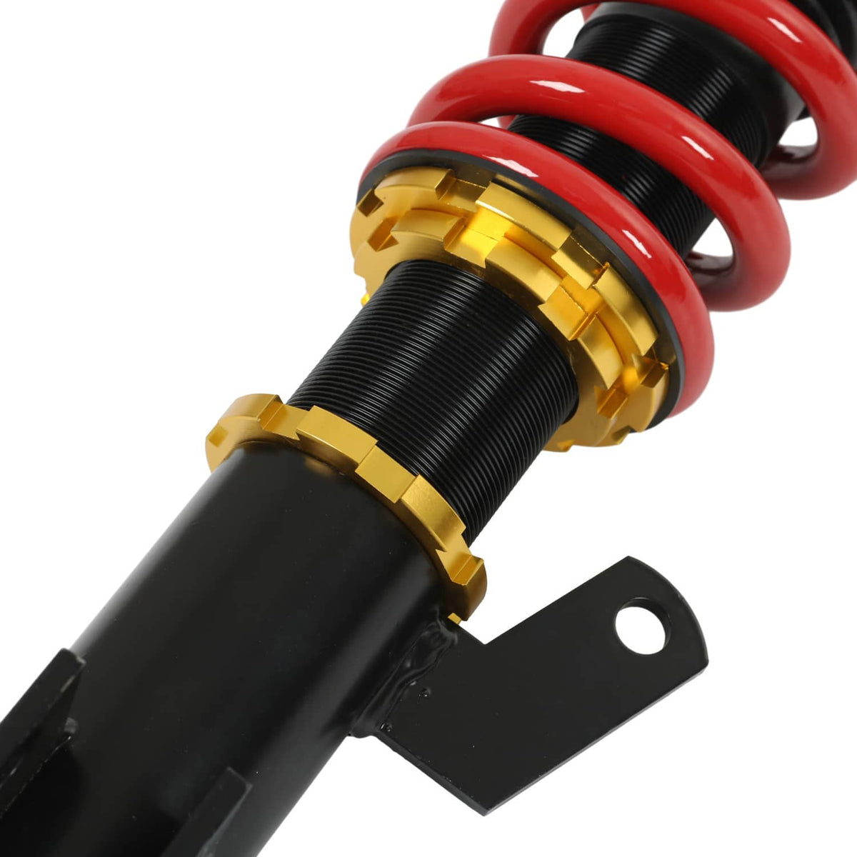 Close-up of coilover spring and gold collar on black shock absorber