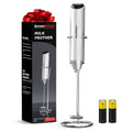 Silver milk frother with stand and whisk, plus two spare battery capsules
