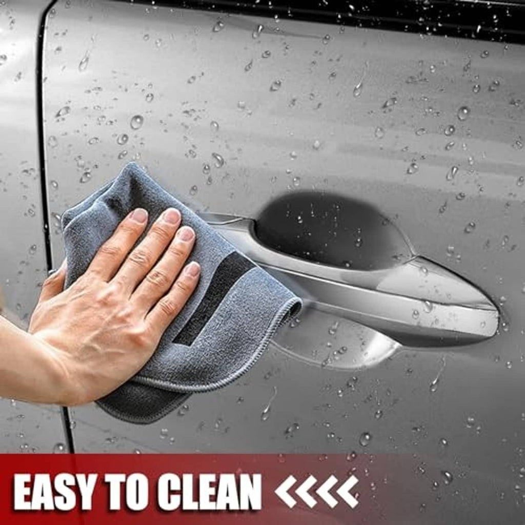 Chrome exterior passenger door handle being cleaned with a microfiber cloth