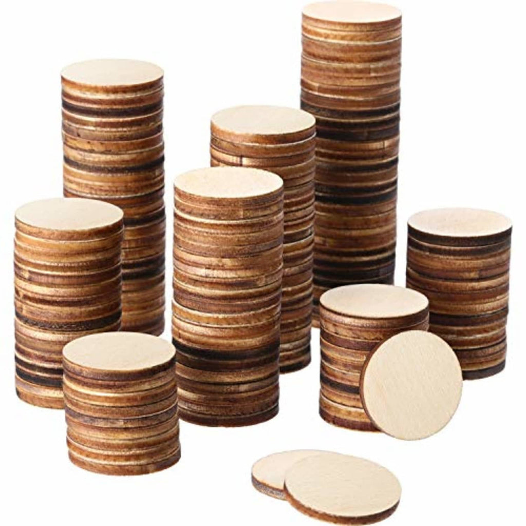 Unfinished round wood craft discs stacked in assorted piles, natural brown edges and light faces