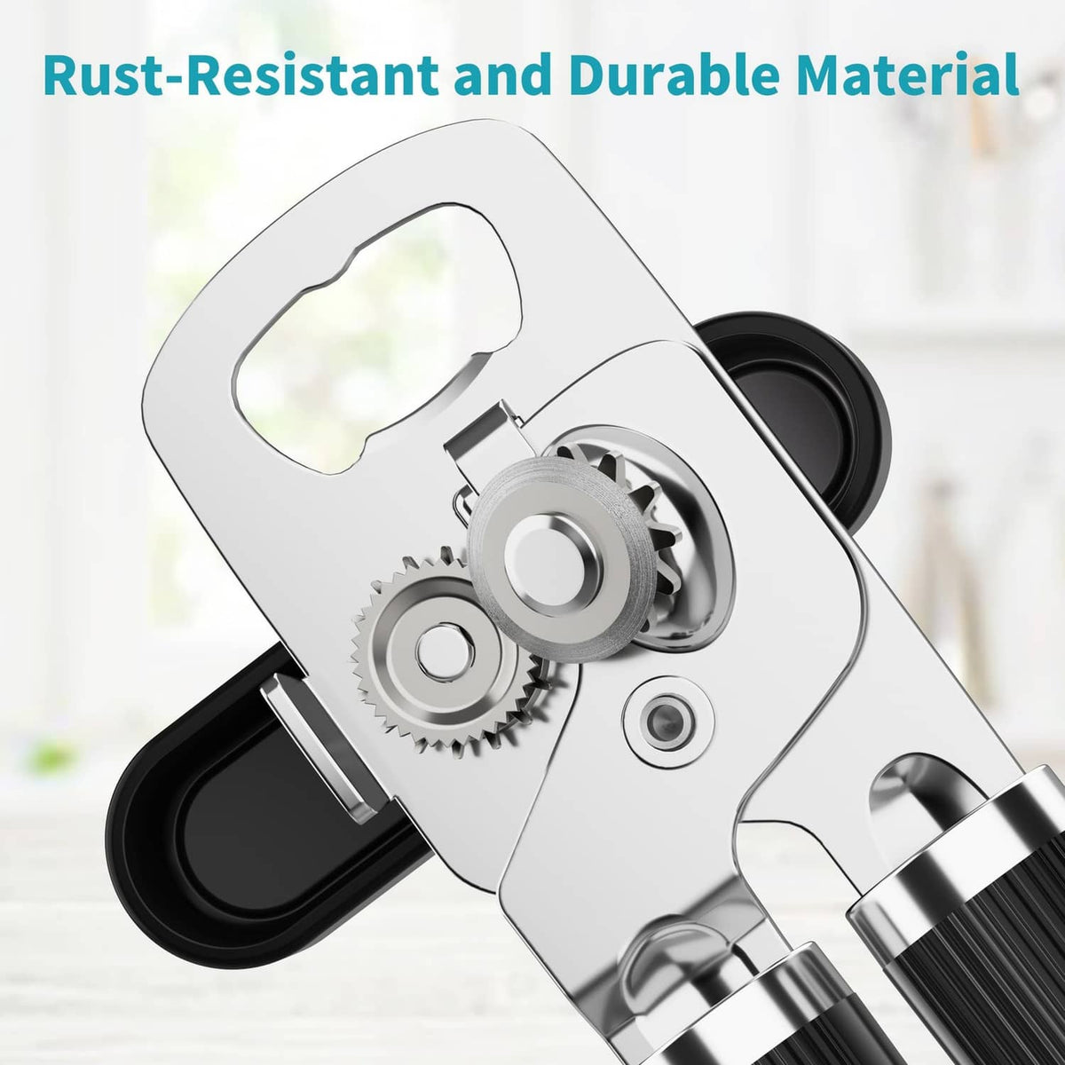 Stainless steel gear mechanism on a black manual can opener and bottle opener, angled.