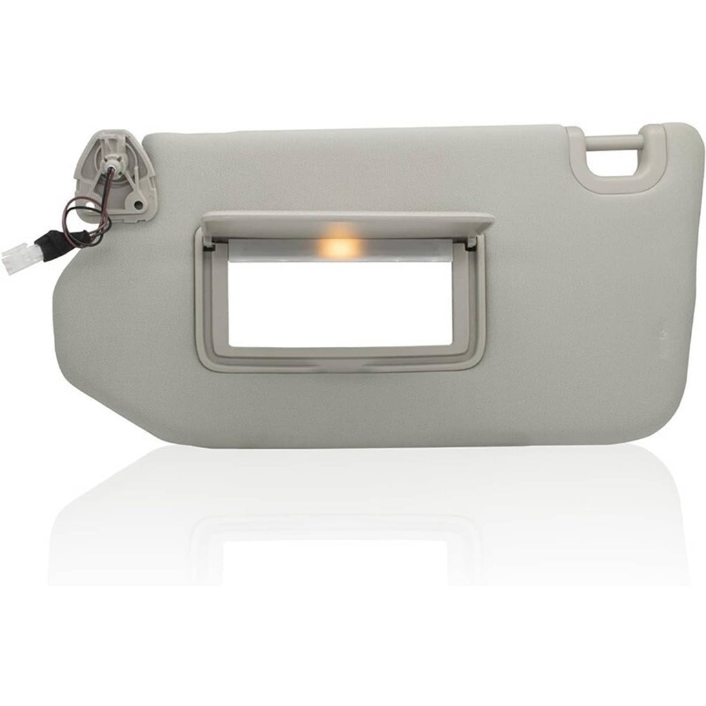 Gray left car sun visor with lit lamp window and rectangular mirror opening