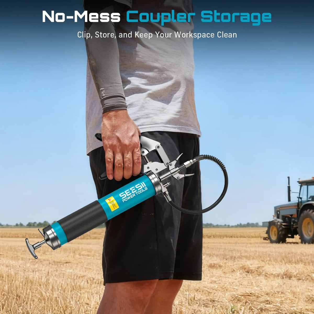 Blue grease gun held outdoors with pistol grip and flexible hose