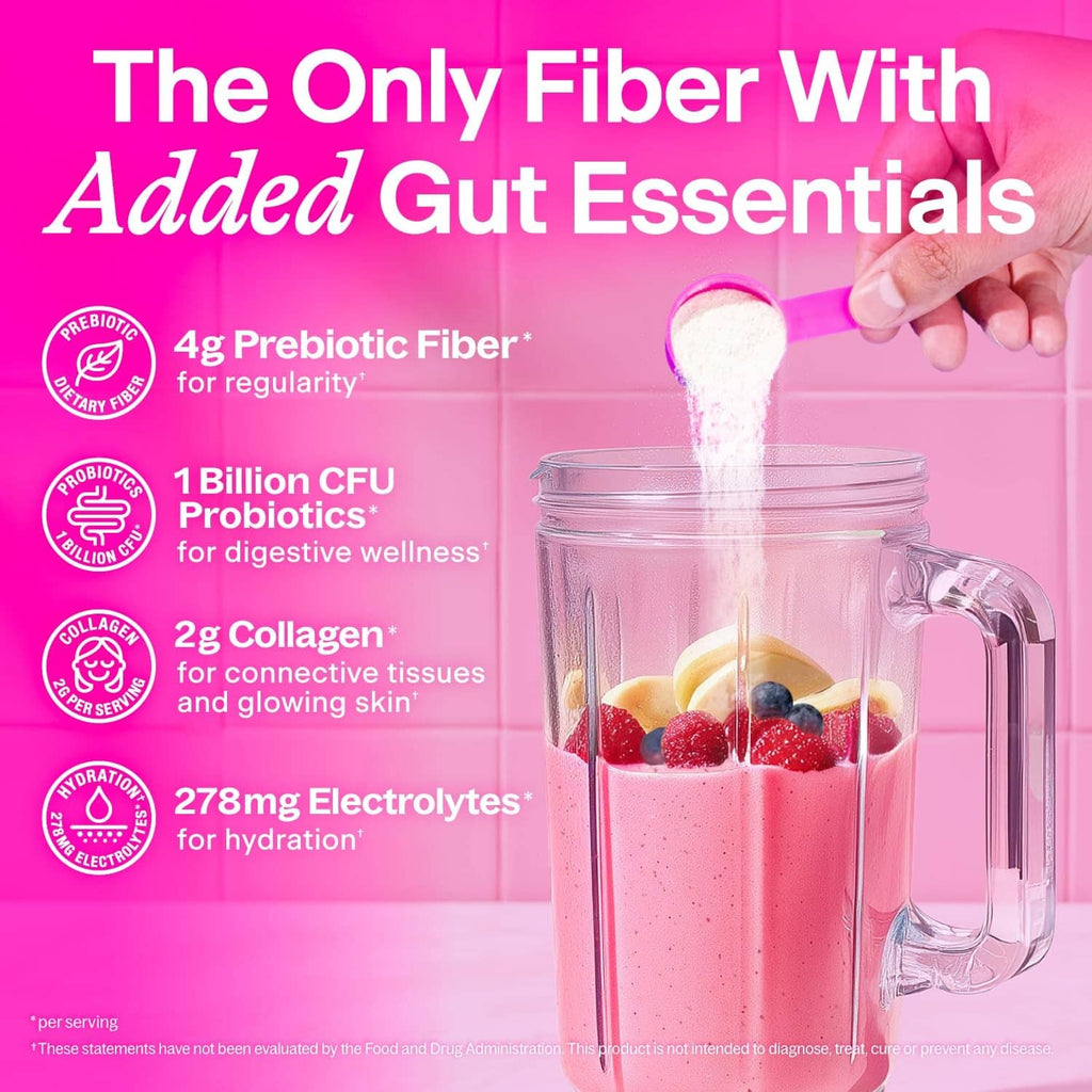 Fiber supplement powder being poured from scoop into a glass drink with fruit and berries.