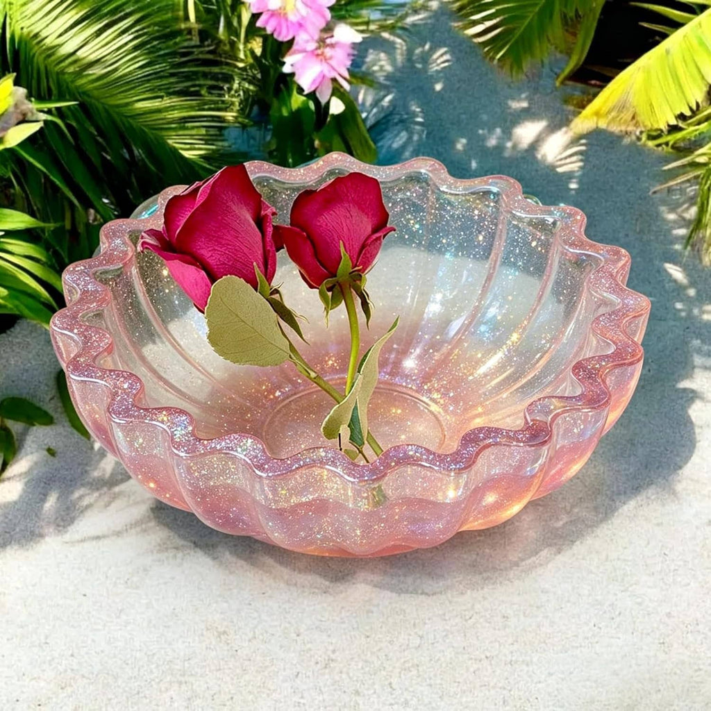 Pink glitter resin bowl with scalloped rim and pink flowers on the inside