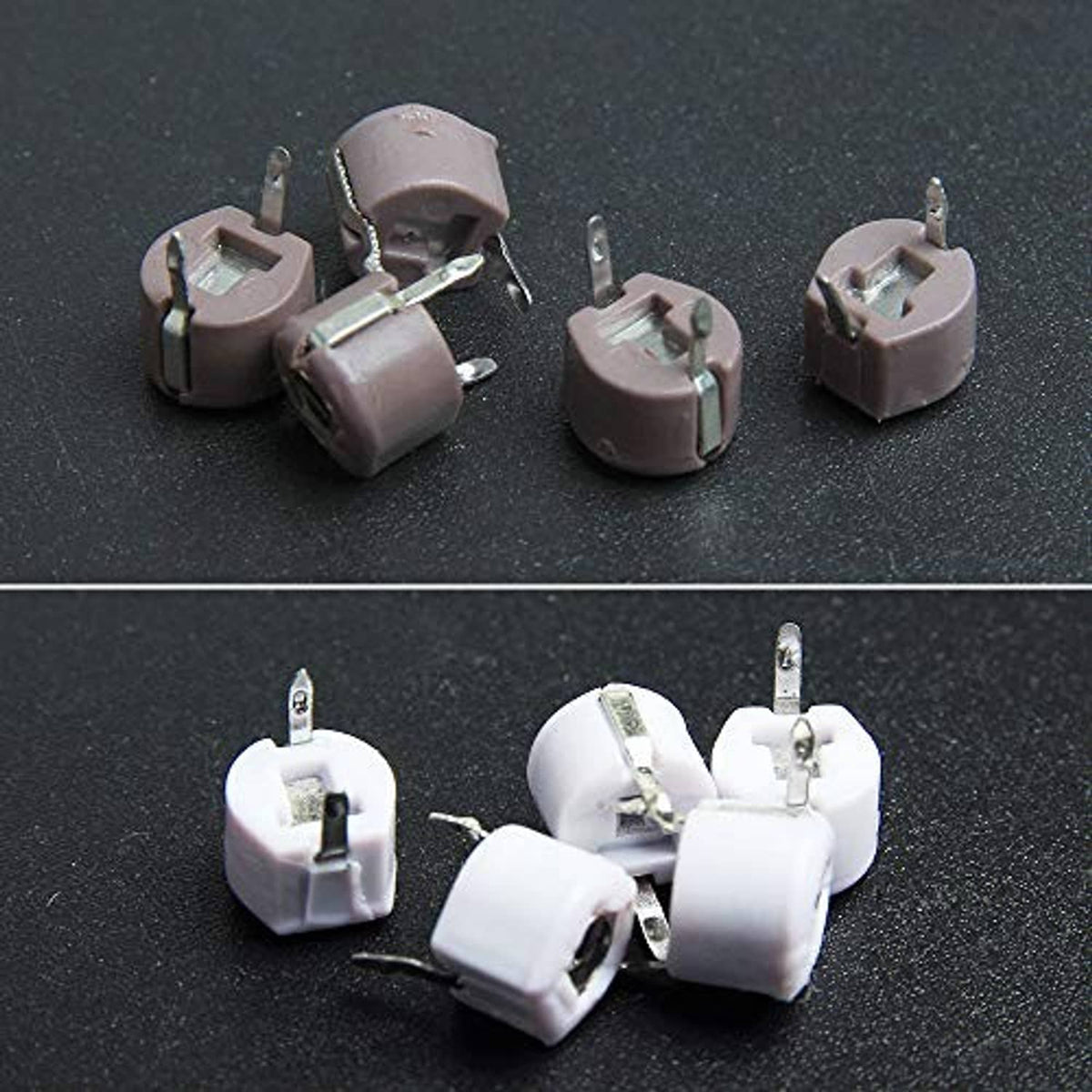 Assorted gray trimmer capacitors with metal pins, round ceramic housings