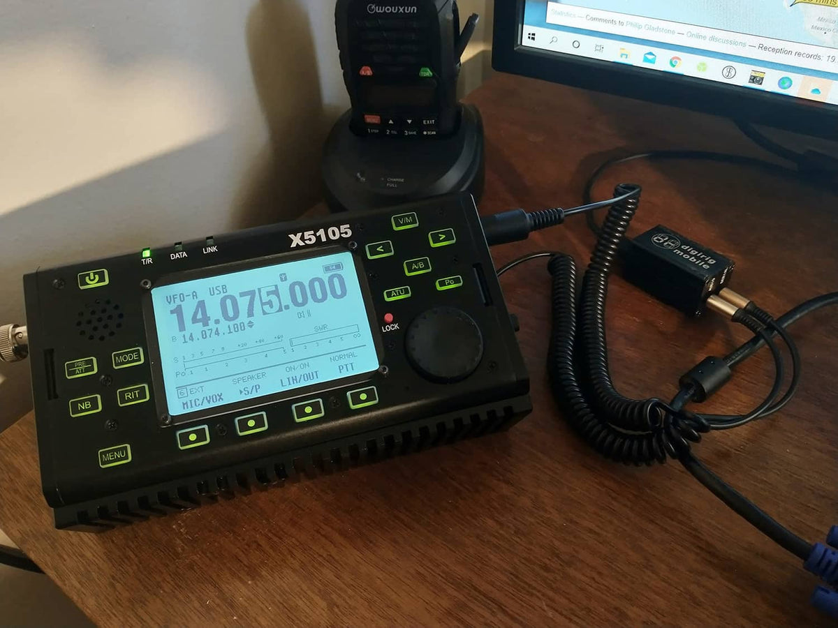 Digirig interface module connected to an amateur radio control unit with cables