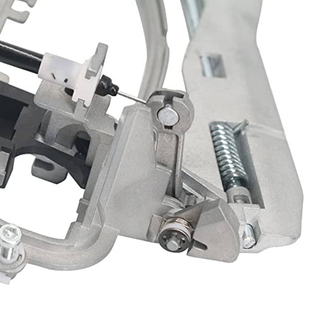 Front door handle carrier close-up of spring, pin, and mounting hardware, gray metal