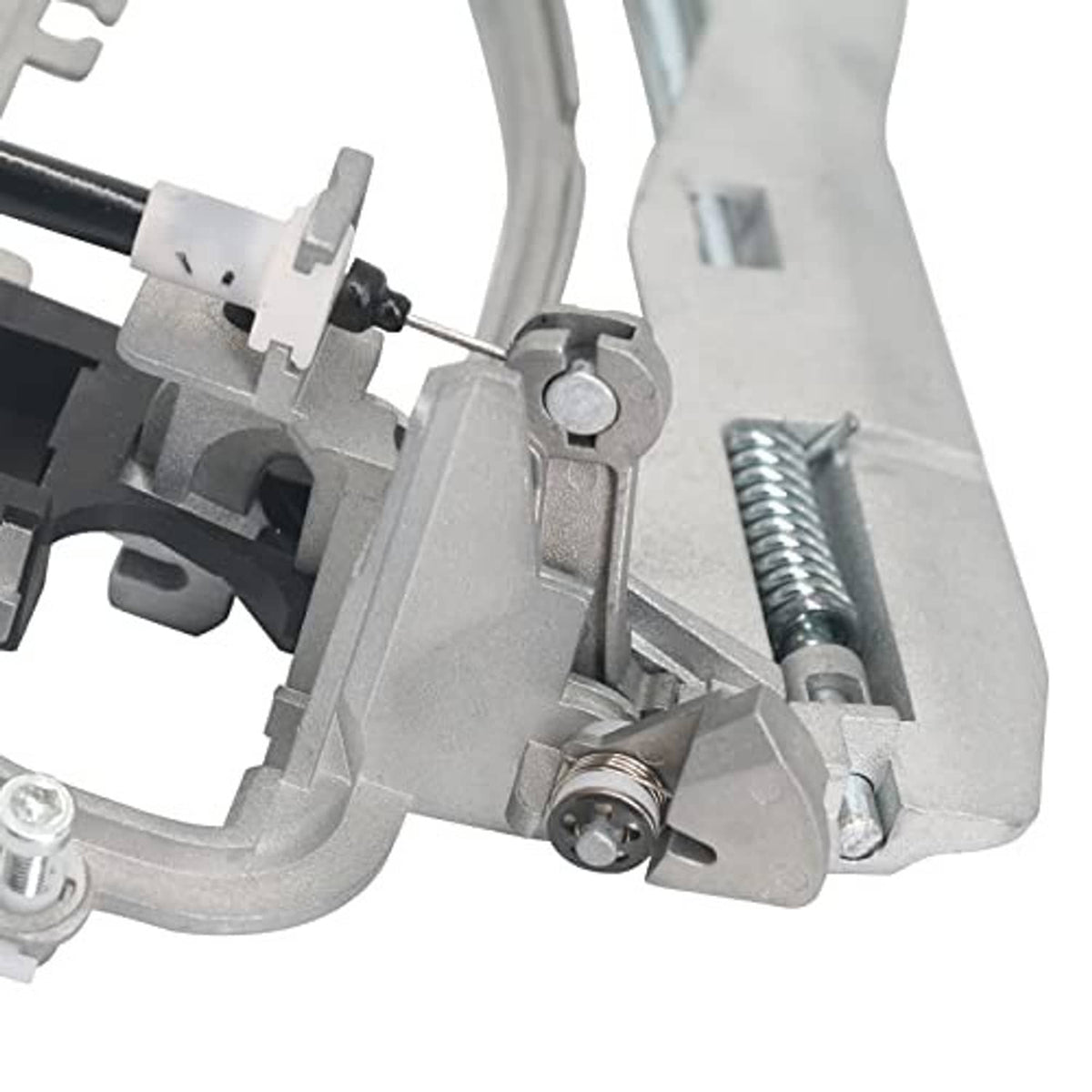 Front door handle carrier close-up of spring, pin, and mounting hardware, gray metal