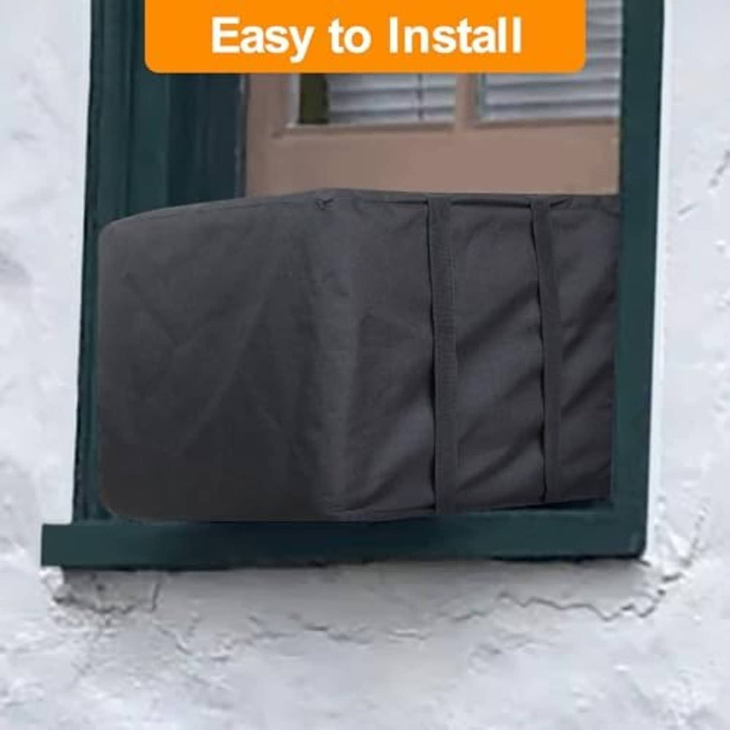 Outdoor AC cover fitted over a window unit in snow, dark fabric with side panels.