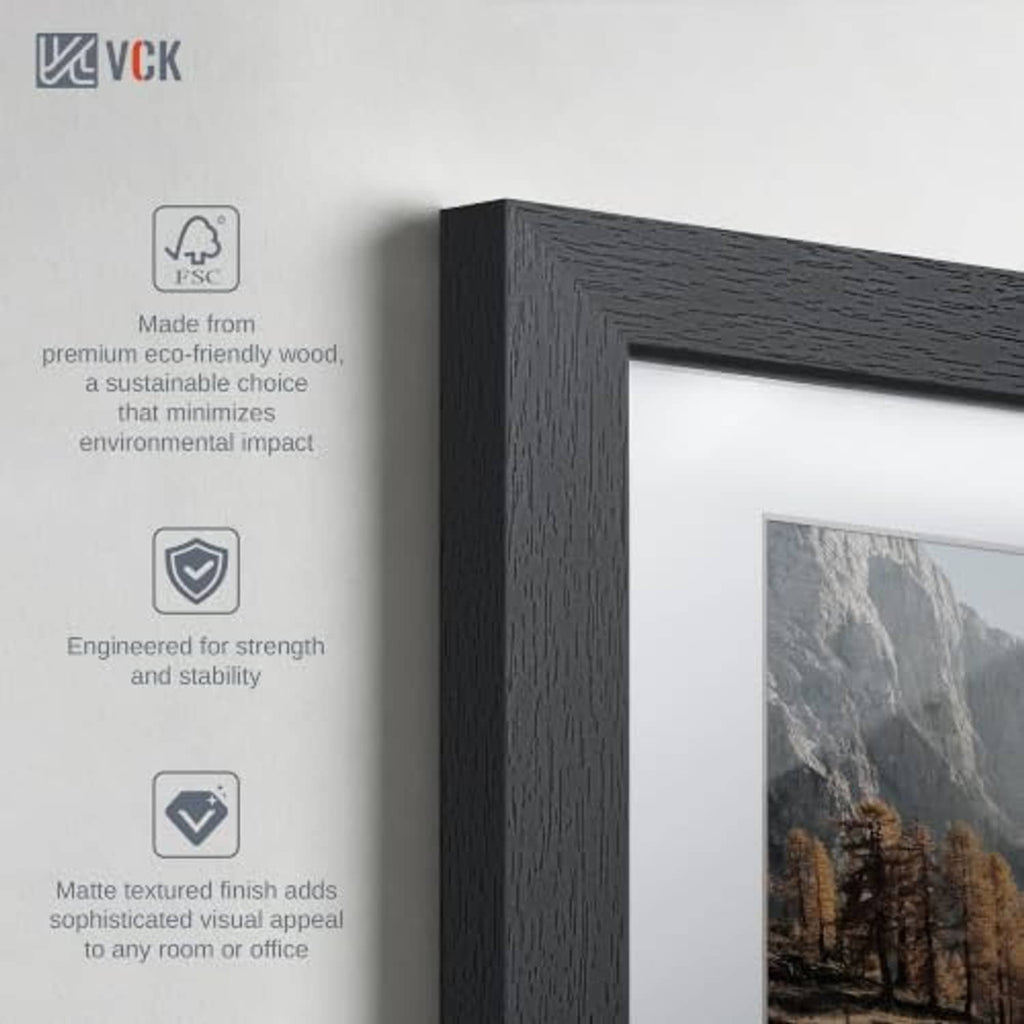Matte textured black wood photo frame edge with glass and mounted image