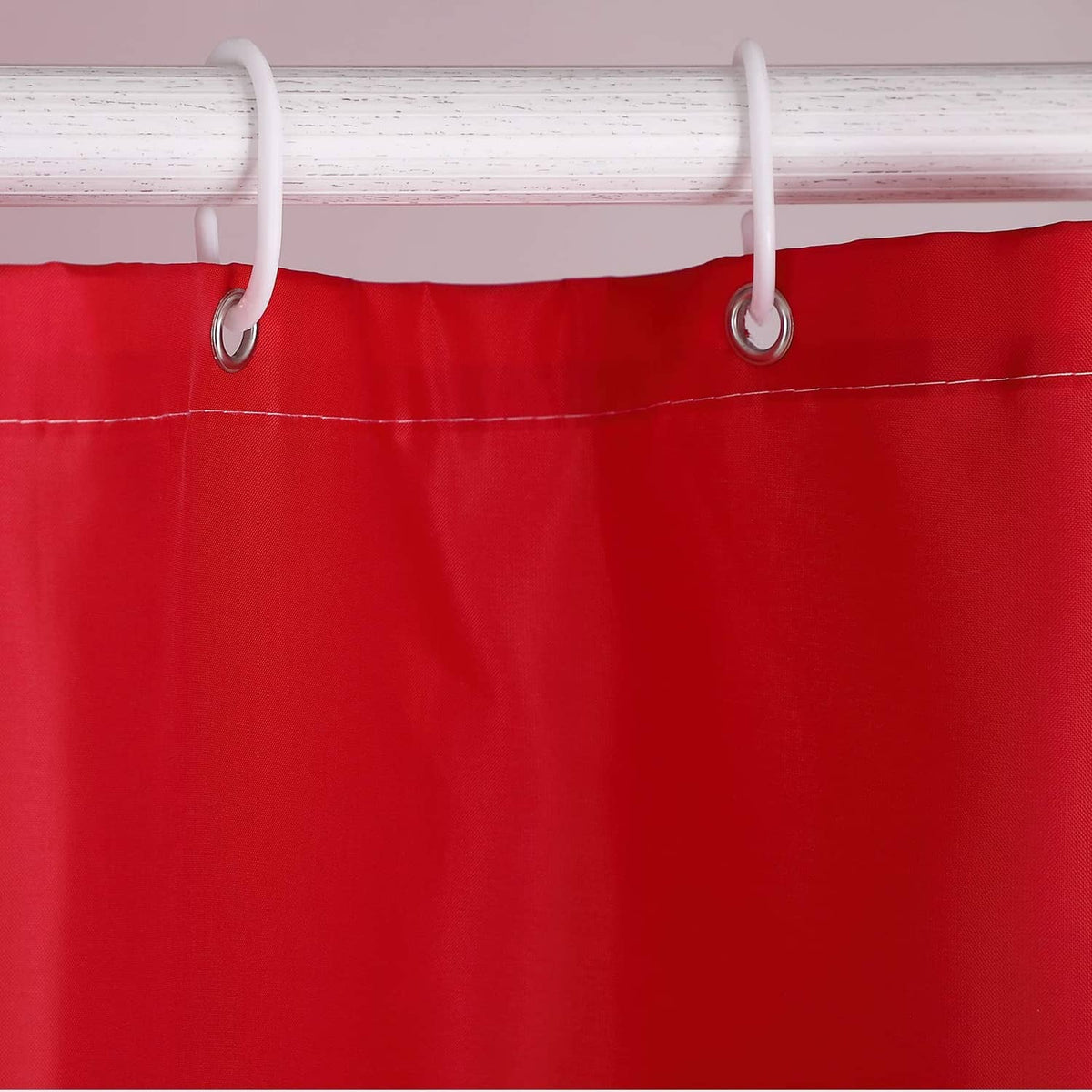 Red shower curtain top band with white grommets and two hanging rings