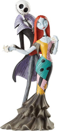 Jack and Sally-style figurine couple, black stitched character with purple dress and red hair