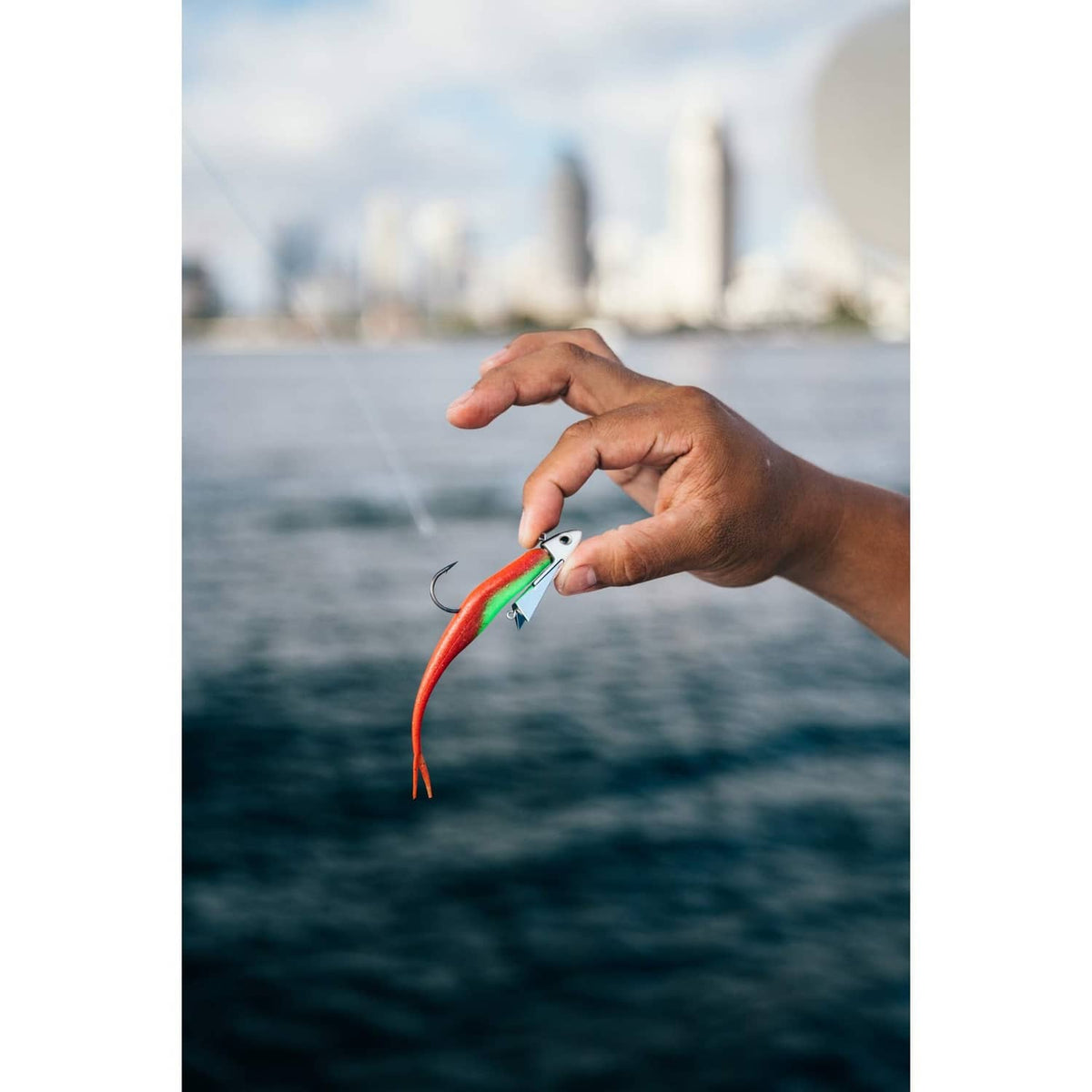 Jerk shad lure in chartreuse pepper color with red tail and hook