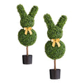 Artificial bunny-shaped boxwood topiary with dark green foliage, yellow bow, black pot.