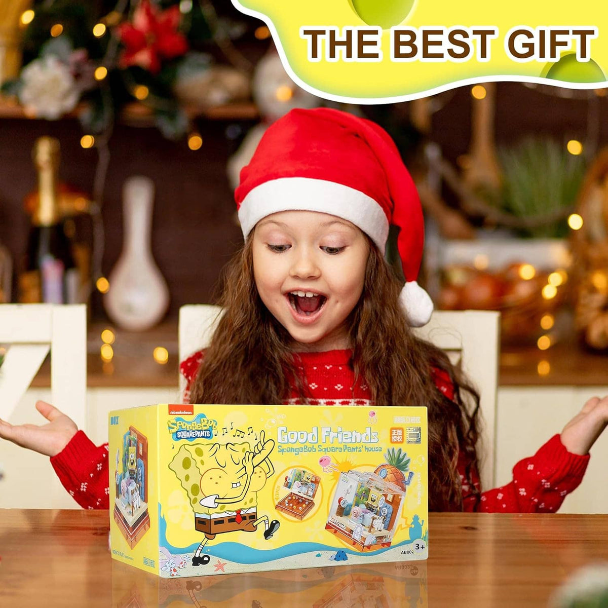Child holding pineapple-themed building block toy set box with character artwork