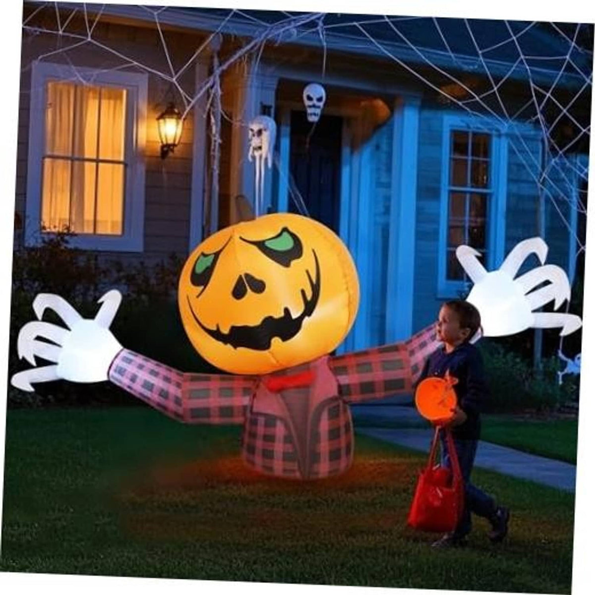 Inflatable 7-ft Halloween pumpkin ghost decoration with orange jack-o-lantern face, plaid outfit