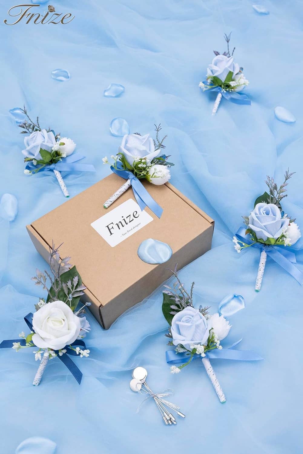 Set of six blue rose and white flower boutonnieres with ribbon loops and sprigs