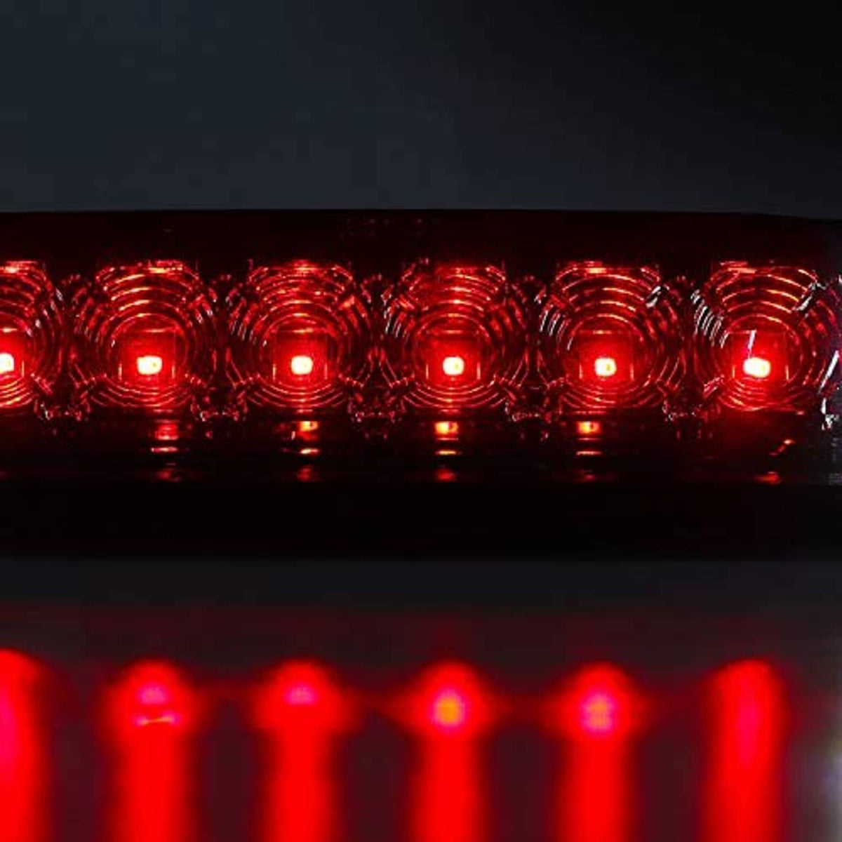 Red LED third brake light panel close-up, chrome housing around the LEDs.