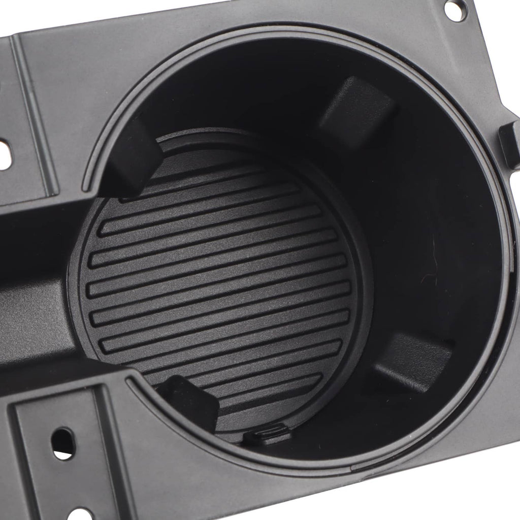 Black round cup holder liner insert with ridged grip pattern and drainage slots