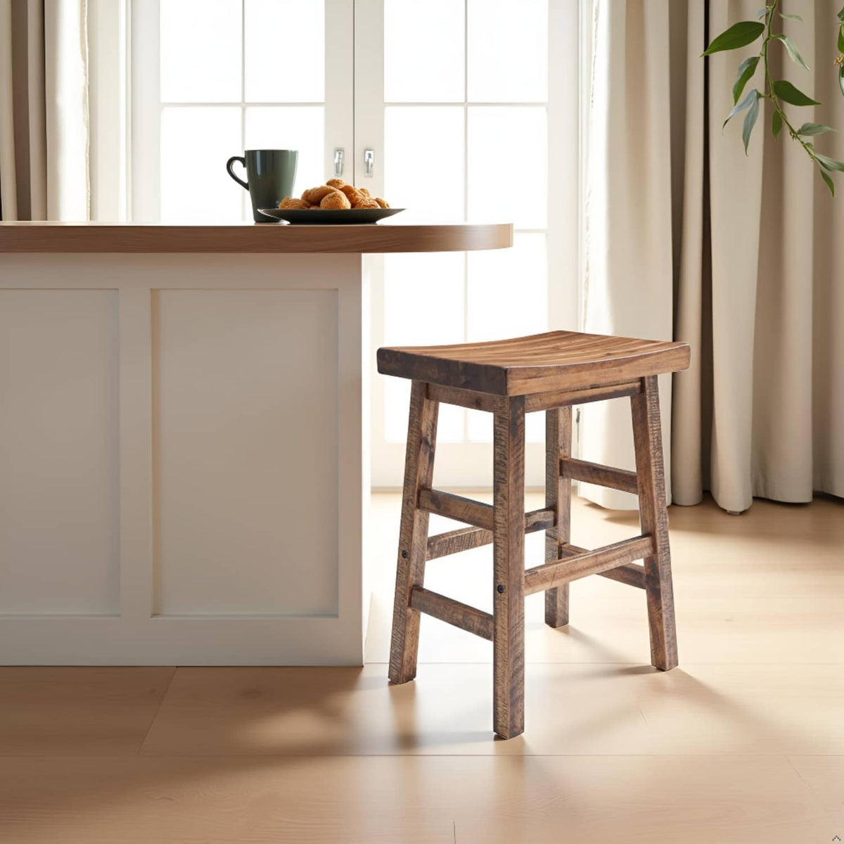 Natural wood counter-height bar stool with saddle seat in a bright kitchen setting