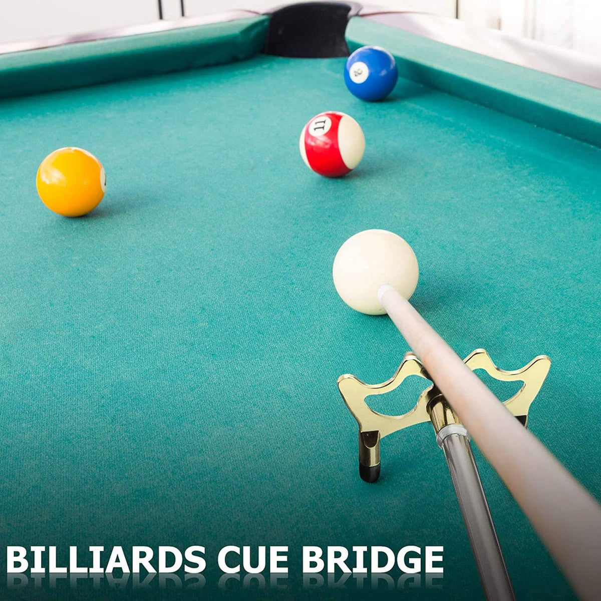 Retractable pool bridge stick with brass head and extended shaft on pool table