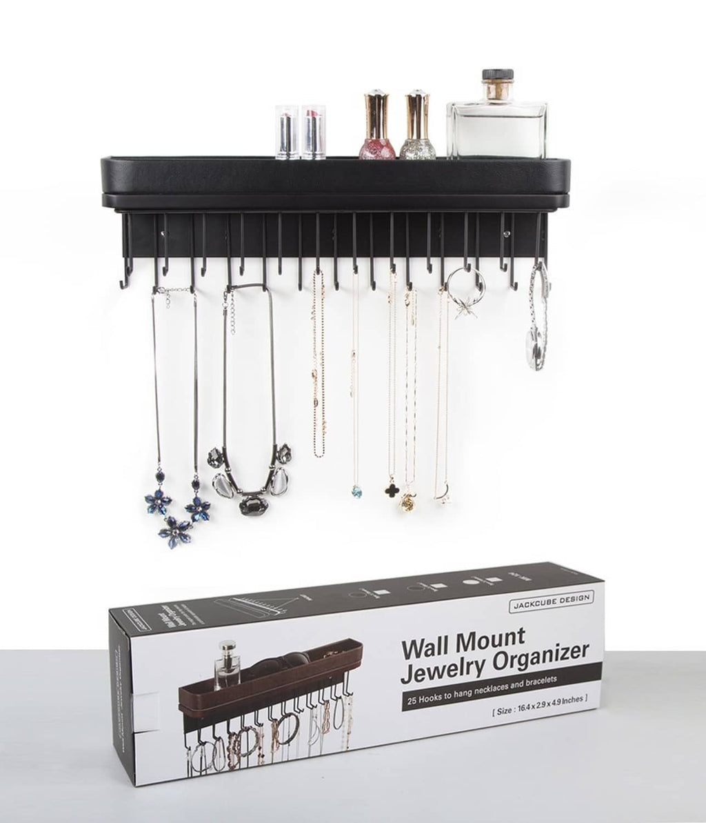 Black wall jewelry organizer with top tray and many hanging necklace hooks