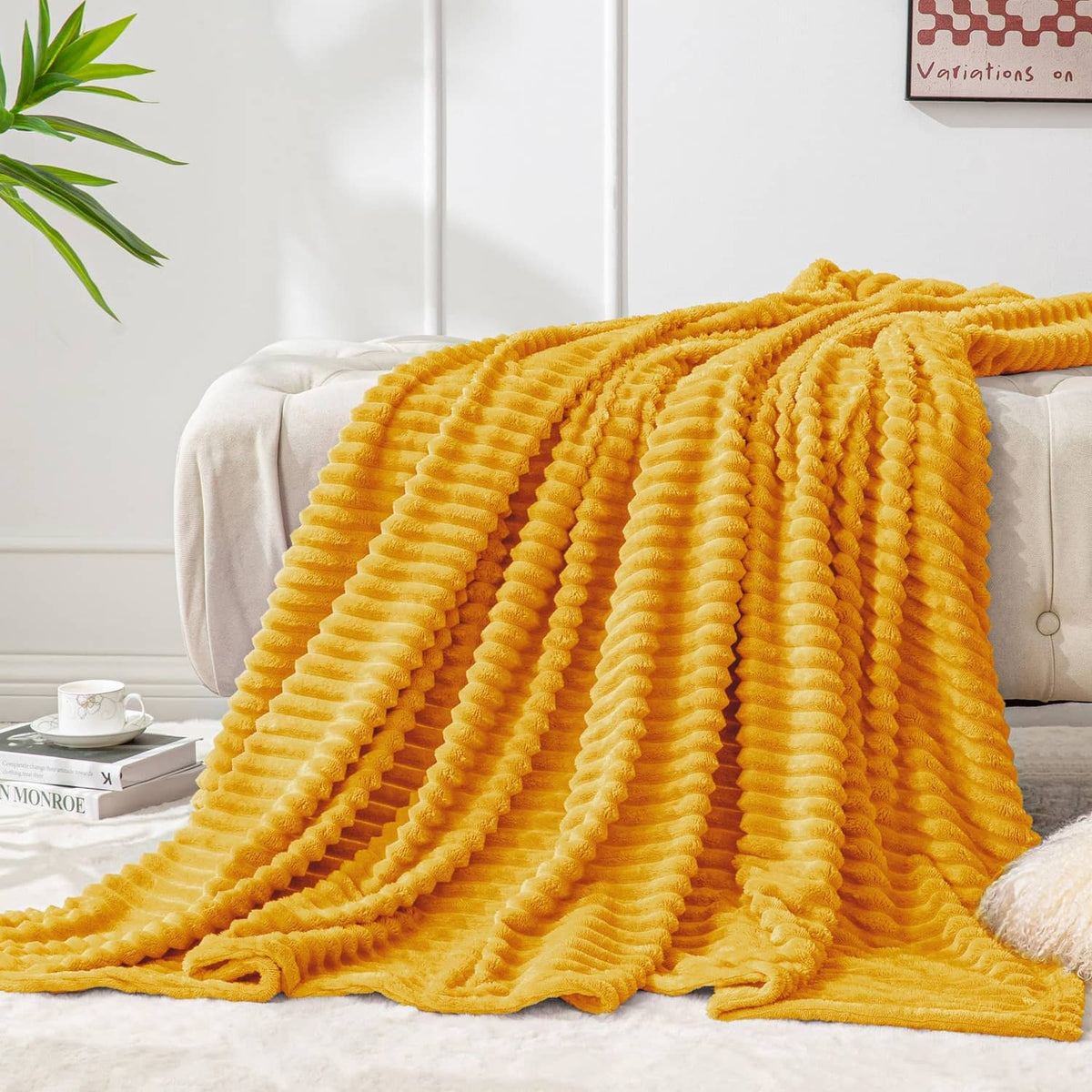 Yellow 3D ribbed jacquard fleece throw blanket, draped with textured ridges