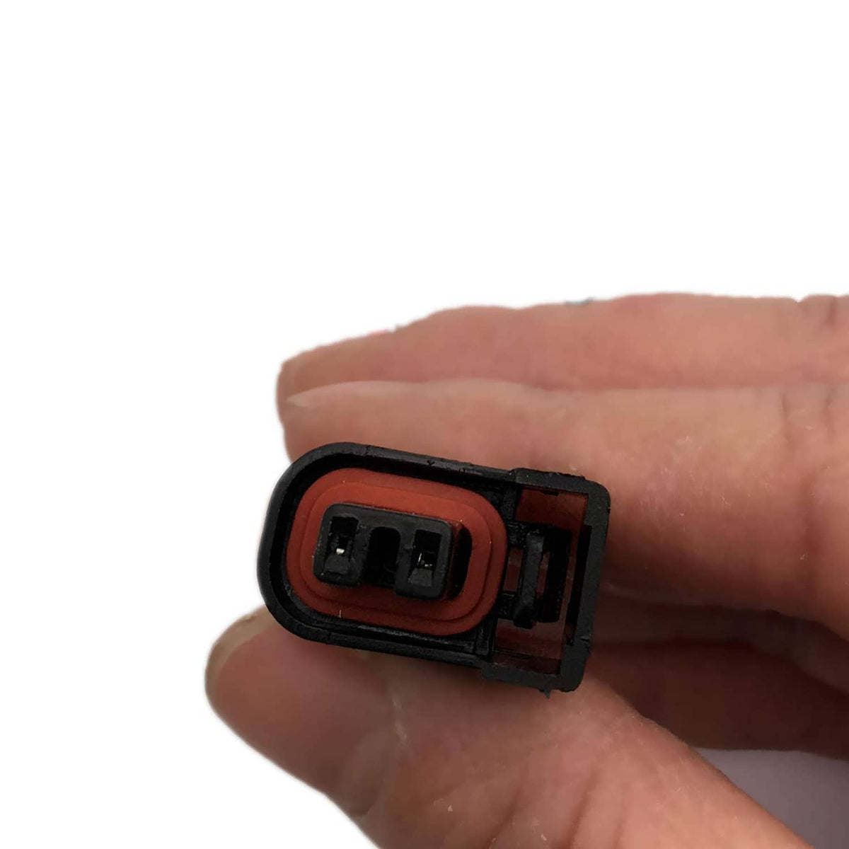Fuel injector connector plug end with red inner seal and black housing