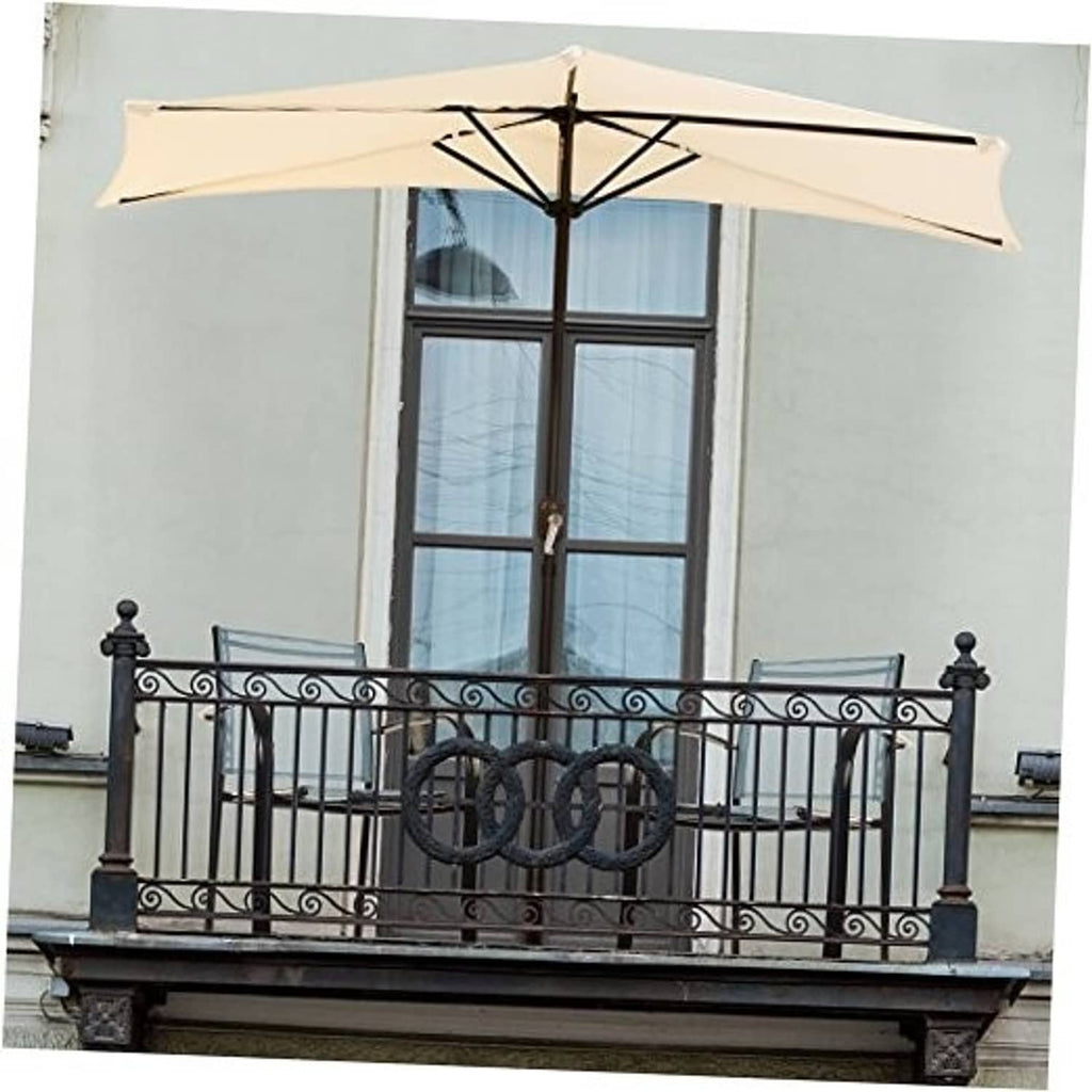Tan half-round patio umbrella on balcony above wrought-iron railing