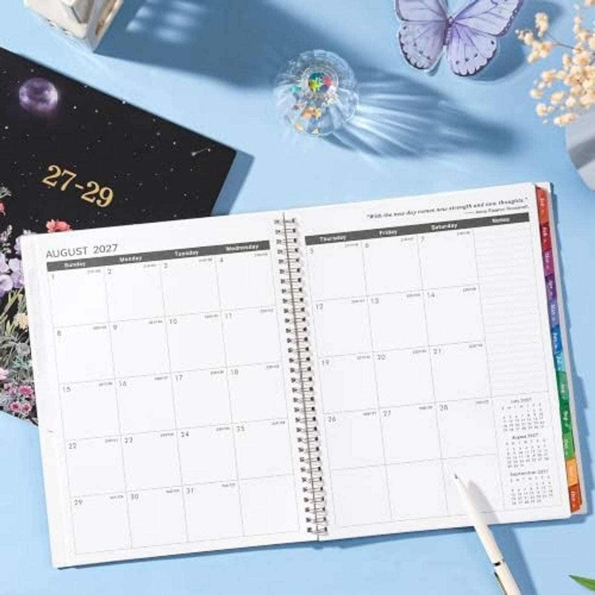 Open monthly planner spread for August 2027 with monthly calendar grid