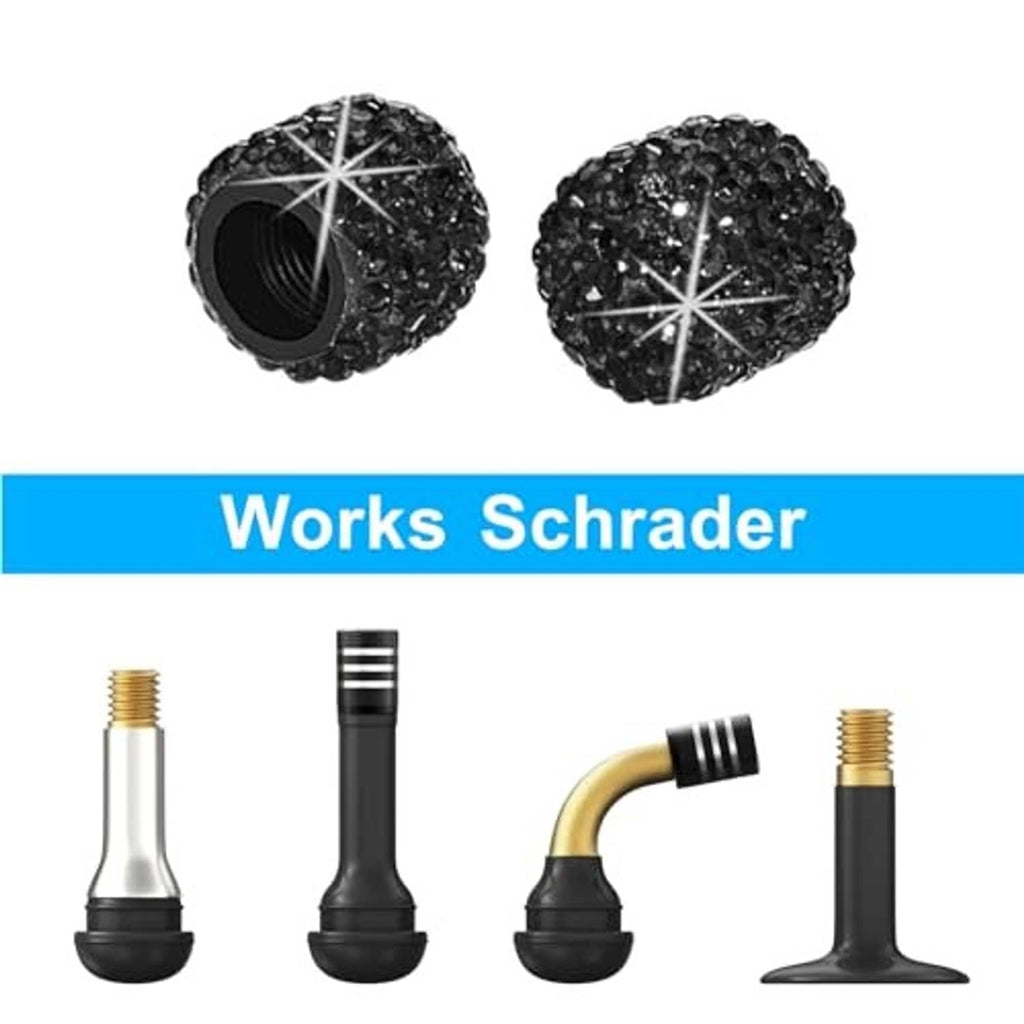 Black rhinestone tire valve stem caps (2 shown), round caps with star cross sparkle design