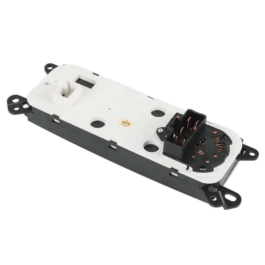 A/C heater climate control module underside with white connector plug and mounting brackets.